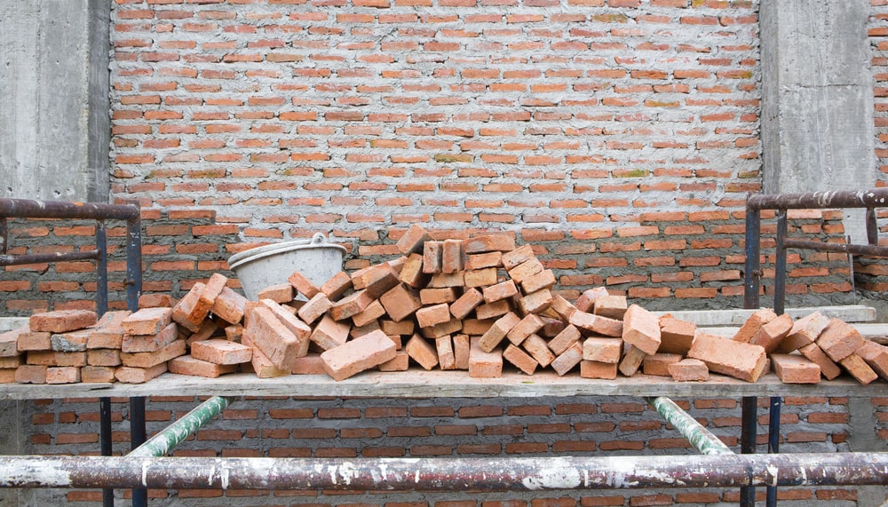 papvoegen van bakstenen muur