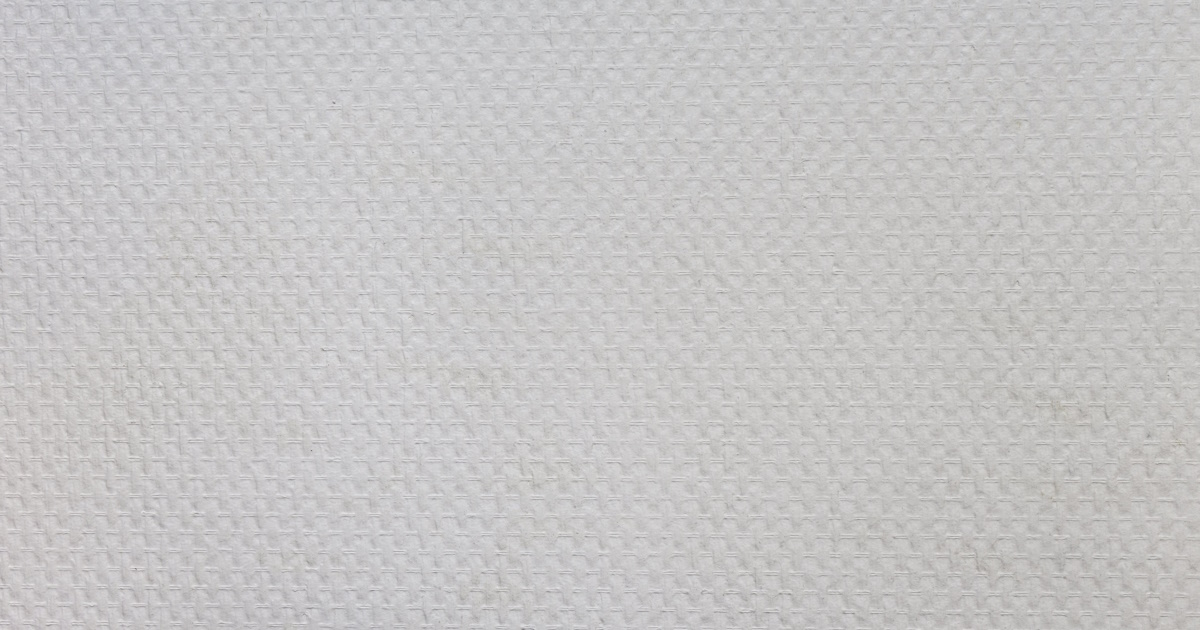 Stuc kan zich goed hechten aan de structuur van glasvezelbehang.