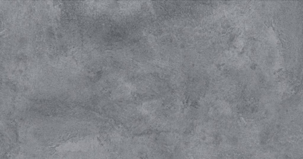 Een gevel van sierpleister met een betonlook met een grijze kleur